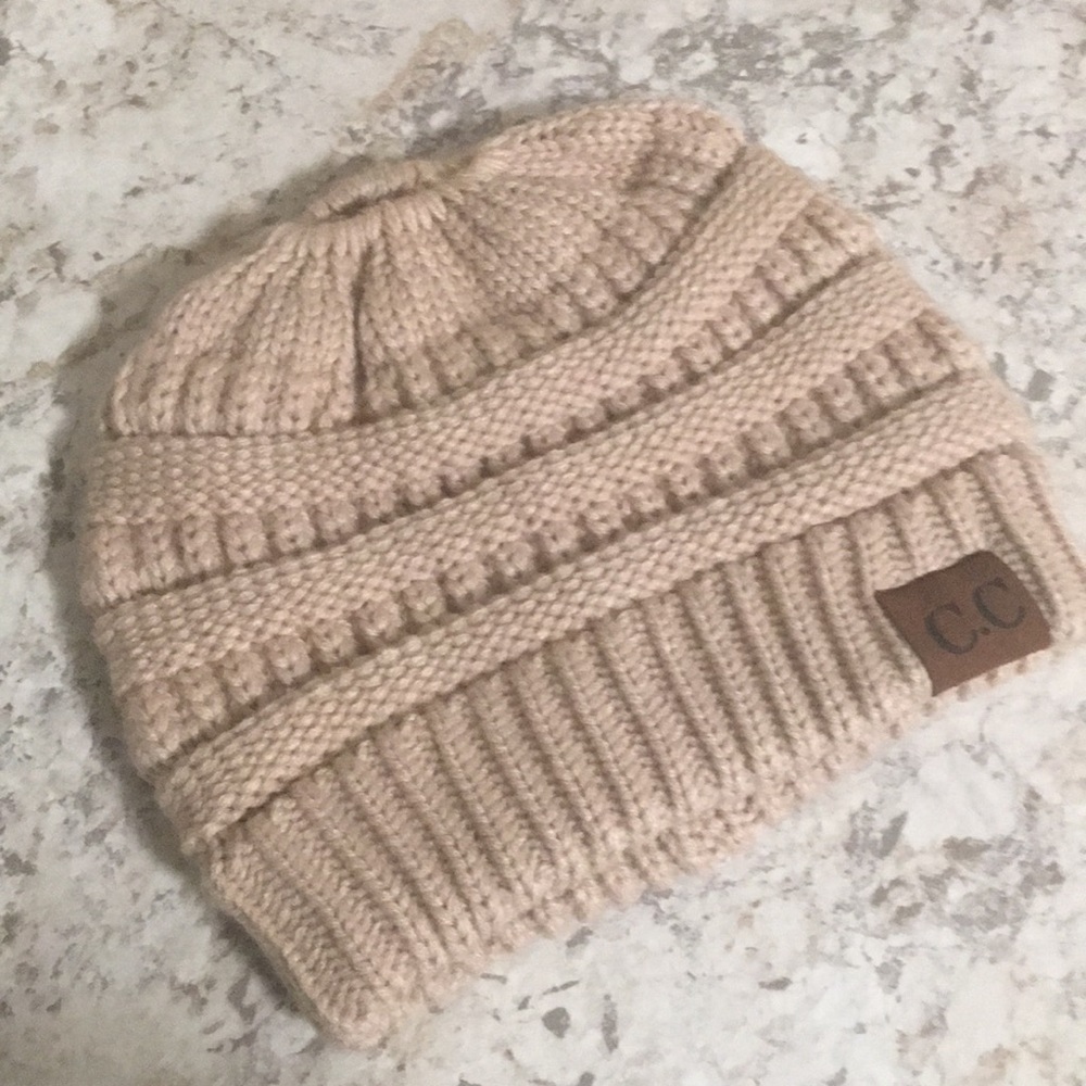 C. C. Beanie with bun opening.